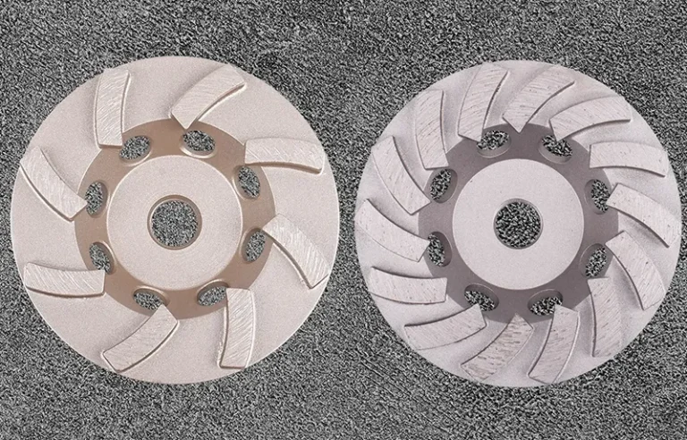 Single row diamond cup wheel and double row concrete grinding wheel side by side on a concrete surface
